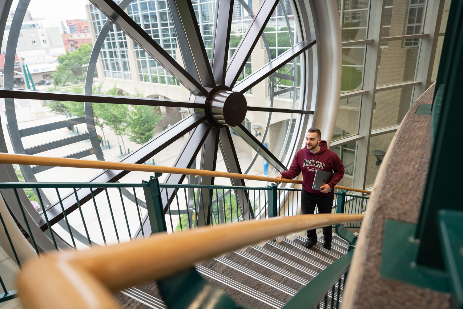 Image of MacEwan Clock from inside on the library stairs